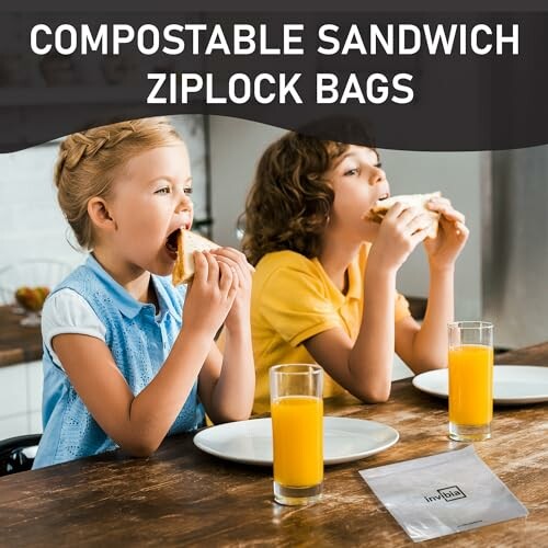 Children eating sandwiches with compostable ziplock bags on table.