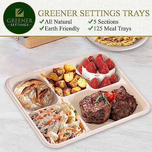 Eco-friendly meal tray with five sections containing steak, coleslaw, bread, roasted potatoes, and strawberries.