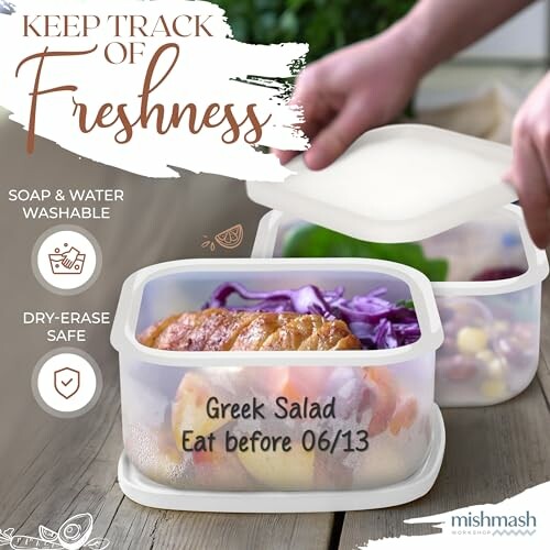 Hands opening a labeled food storage container with Greek salad.