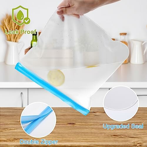 Person holding a clear reusable food storage bag with a blue double zipper and upgraded seal.